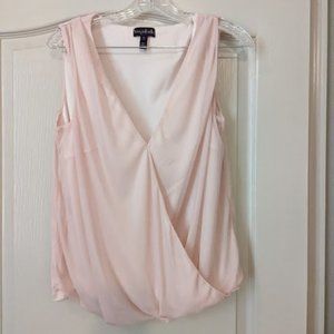 Sleeveless and shimmery blouson top